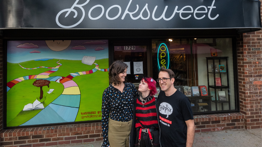 Booksweet co-owners Truly and Shaun outside of Booksweet with their child Raymond.